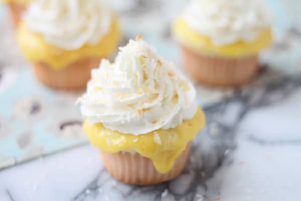 Coconut Cupcakes with Lemon Curd, Vanilla Whipped Cream and Toasted Coconut