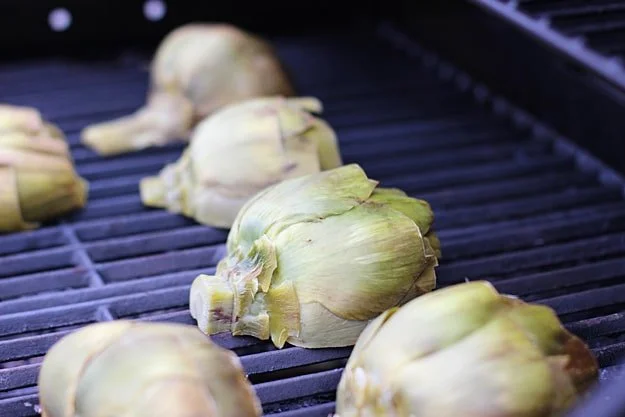 Grilled Artichokes with Rosemary Lemon Vinaigrette and Garlic Breadcrumbs via cookingforkeeps.com