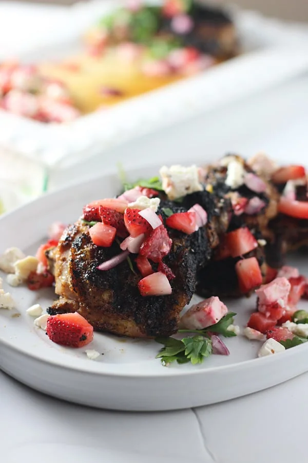 Blackened Chicken Thighs with Strawberry Feta Salsa via cookingforkeeps.com
