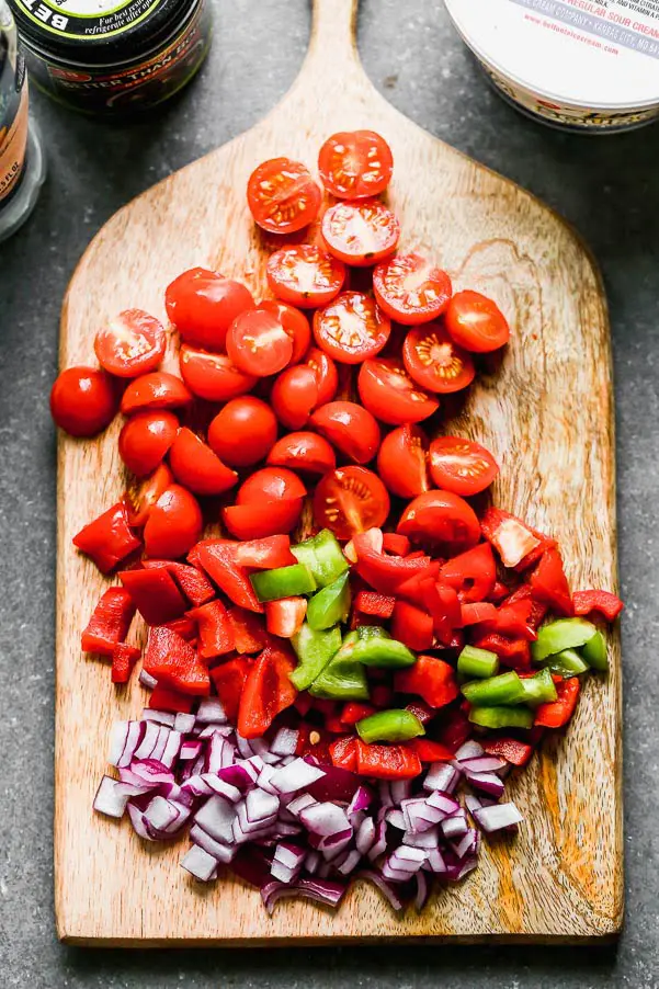Cherry tomatoes, bell peppers, and red onion
