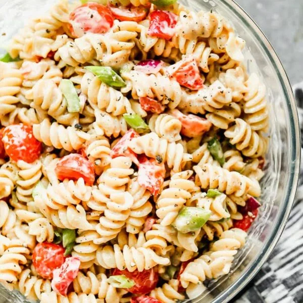 This is The BEST Creamy Pasta Salad you will ever make, promise. Thanks to one secret ingredient, this classic creamy pasta salad is infinitely flavorful. Throw in your favorite veggies, cook up your favorite pasta, and watch this easy pasta salad disappear. 