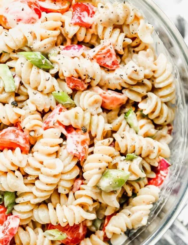 This is The BEST Creamy Pasta Salad you will ever make, promise. Thanks to one secret ingredient, this classic creamy pasta salad is infinitely flavorful. Throw in your favorite veggies, cook up your favorite pasta, and watch this easy pasta salad disappear. 