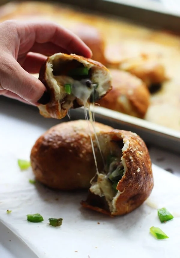 Philly Cheese Steak Pretzel Rolls - All your favorite Philly components stuffed in a pretzel roll!