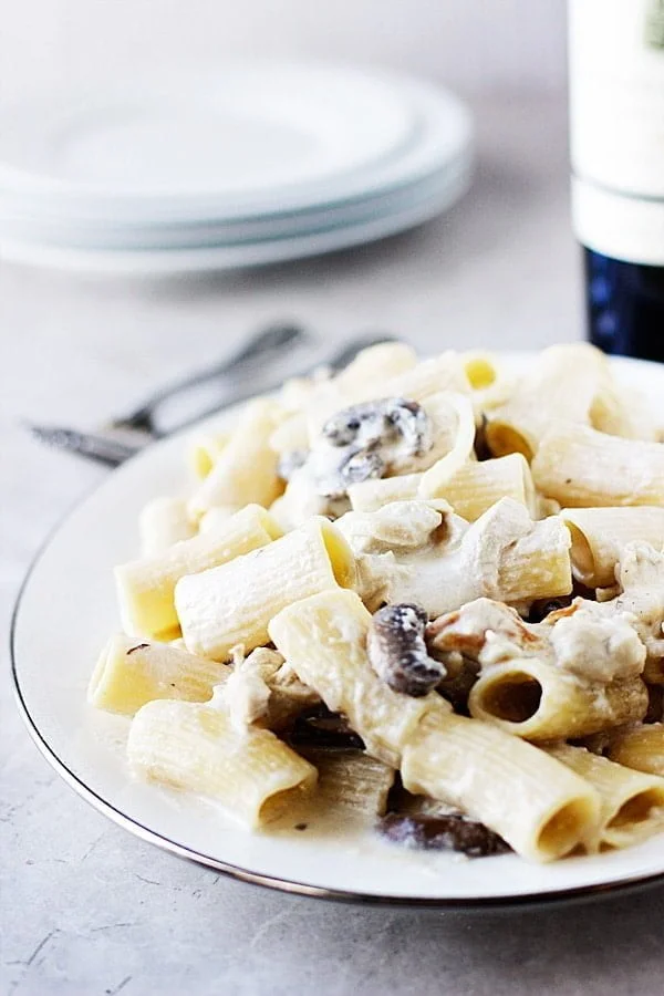 Creamy Fontina Rigatoni with Roasted Garlic, Portabellas and Pulled Chicken | cookingforkeeps.com