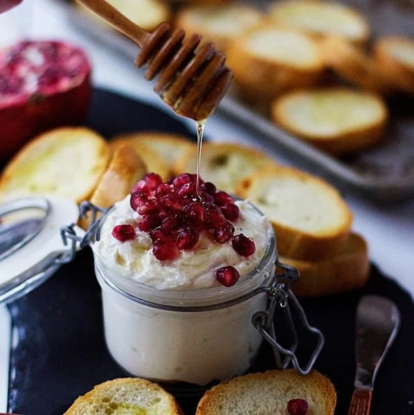 Whipped Goat Cheese with Honey and Pomegranates - Ten minute prep for this elegant app!|  cookingforkeeps.com #goatcheese #holidayentertaining