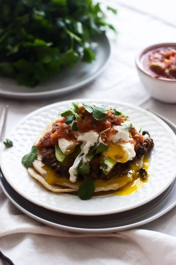 Mexican Breakfast Tostadas with Chorizo Re-fried Beans, Avocado and Poached Eggs