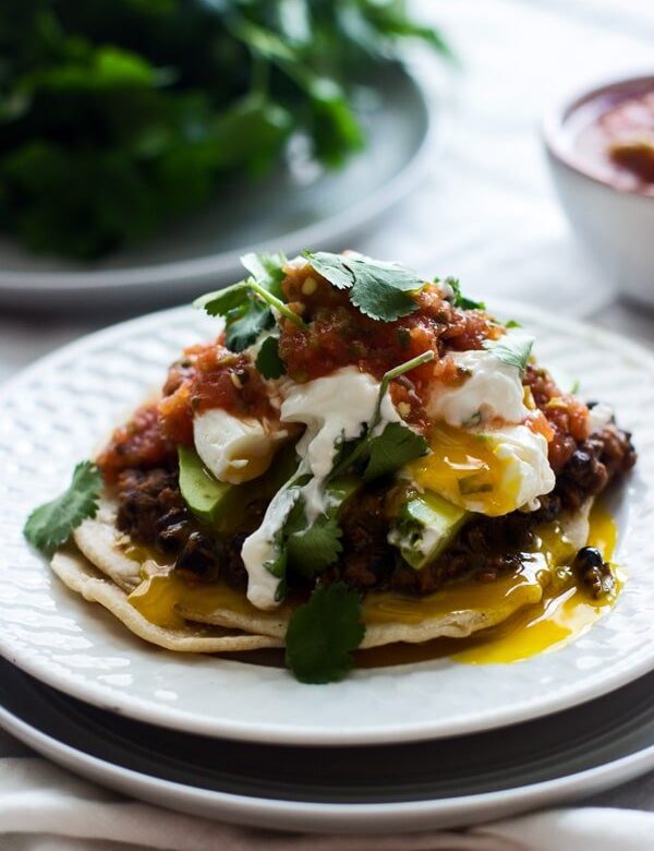 Mexican Breakfast Tostadas with Chorizo Re-fried Beans, Avocado and Poached Eggs