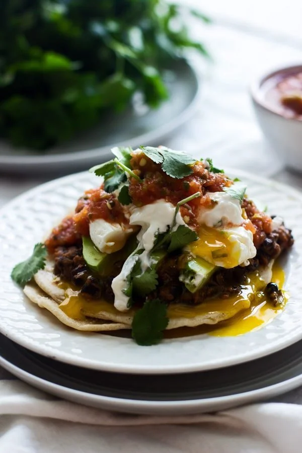 Mexican Breakfast Tostadas with Chorizo Re-fried Beans, Avocado and Poached Eggs