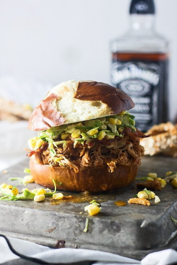Slow-Cooker Bourbon Brown Sugar Pulled Chicken Sandwiches with Bacon and Brussels Sprout Corn Slaw