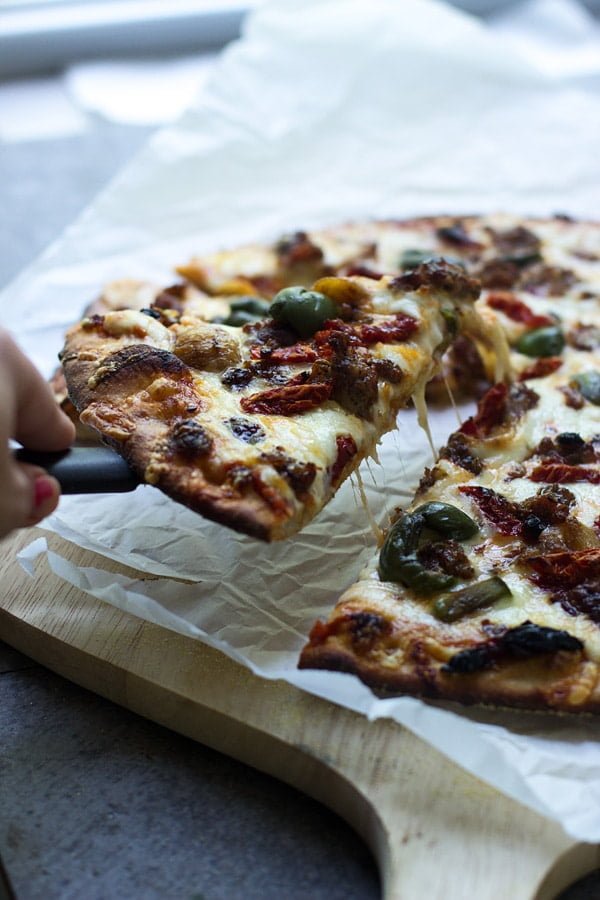 Spanish Olive, Roasted Garlic and Sun-Dried Tomato Pizza + How to make restaurant-quality pizza at home every time! 