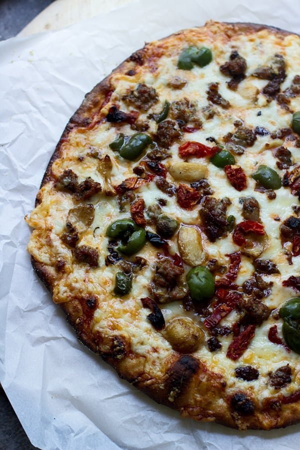 Spanish Olive, Roasted Garlic and Sun-Dried Tomato Pizza + How to make restaurant-quality pizza at home every time!