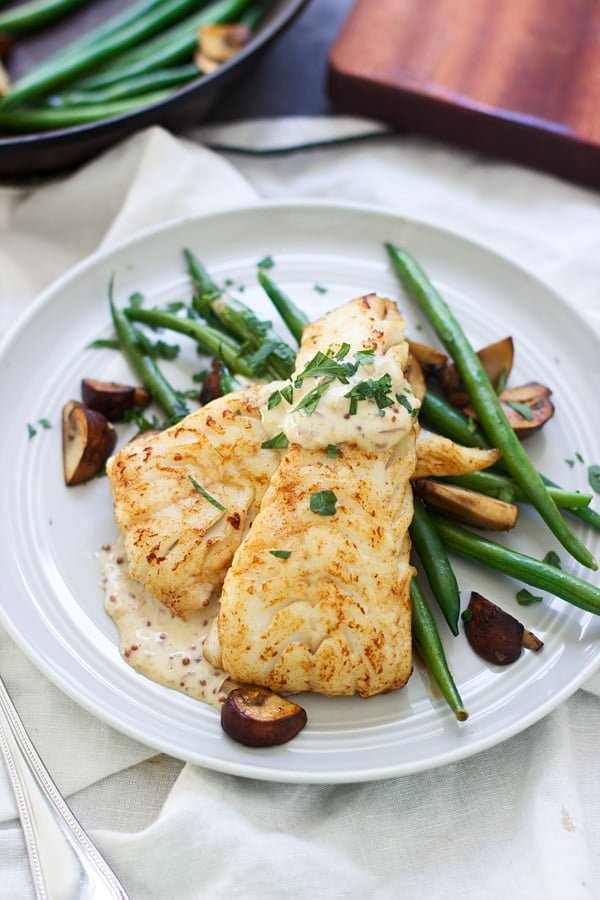 Brown Butter Seared Haddock with Mustard Cream Sauce - I promise, this will be your new favorite seafood dish! Super easy, minimal ingredients and comes together in under 30 minutes.