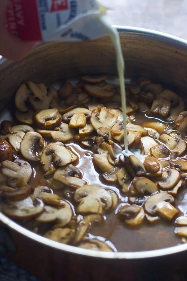 Add heavy cream to marsala wine and mushrooms