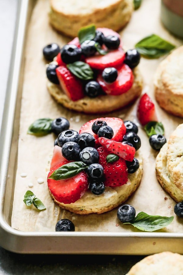 Once you try our Lemon Strawberry Shortcakes with Warm Sweet Cream, you may never be able to eat another dessert again. We take super-soft lemon and basil shortcakes, fill them with macerated berries, and then drown them in warm sweetened cream. Heaven on earth.&nbsp;