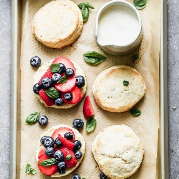 Once you try our Lemon Strawberry Shortcakes with Warm Sweet Cream, you may never be able to eat another dessert again. We take super-soft lemon and basil shortcakes, fill them with macerated berries, and then drown them in warm sweetened cream. Heaven on earth.