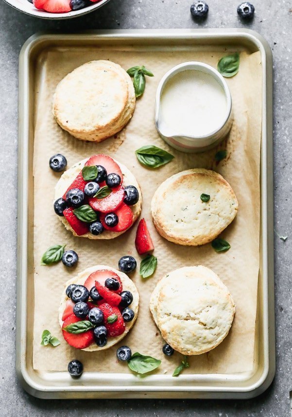 Once you try our Lemon Strawberry Shortcakes with Warm Sweet Cream, you may never be able to eat another dessert again. We take super-soft lemon and basil shortcakes, fill them with macerated berries, and then drown them in warm sweetened cream. Heaven on earth.&nbsp;