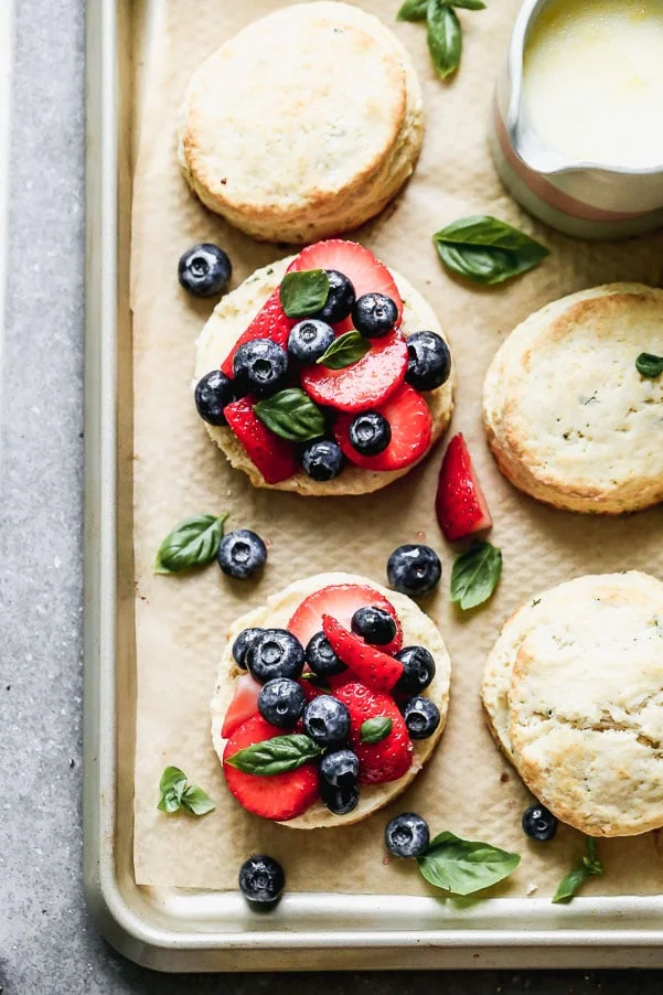 Once you try our Lemon Strawberry Shortcakes with Warm Sweet Cream, you may never be able to eat another dessert again. We take super-soft lemon and basil shortcakes, fill them with macerated berries, and then drown them in warm sweetened cream. Heaven on earth.&nbsp;