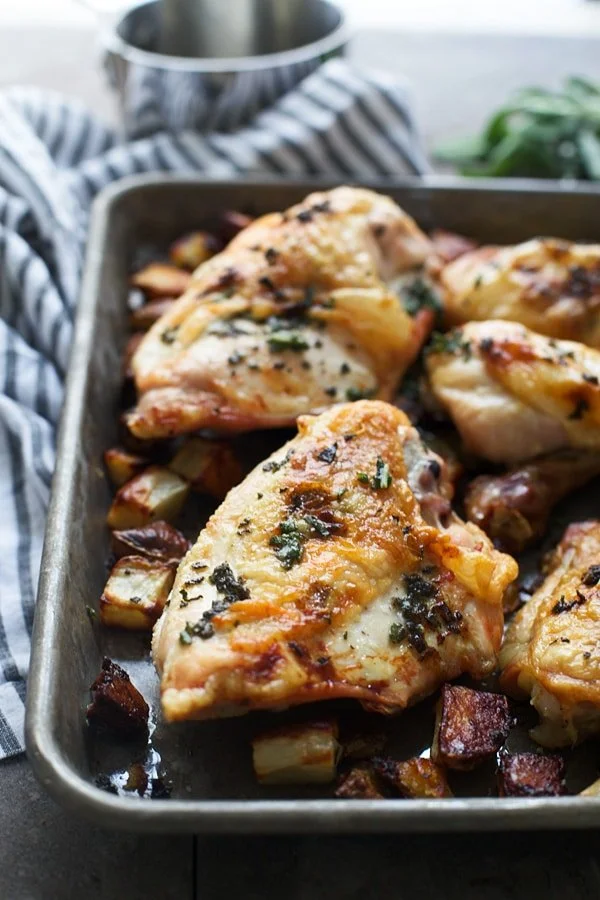 This Five Ingredient Sage Butter (Faux) Roasted Chicken uses individual chicken pieces instead of a whole chicken, and is cooked at a lower temperature for a juicy and super tender end result. It's the perfect easy, weeknight meal!