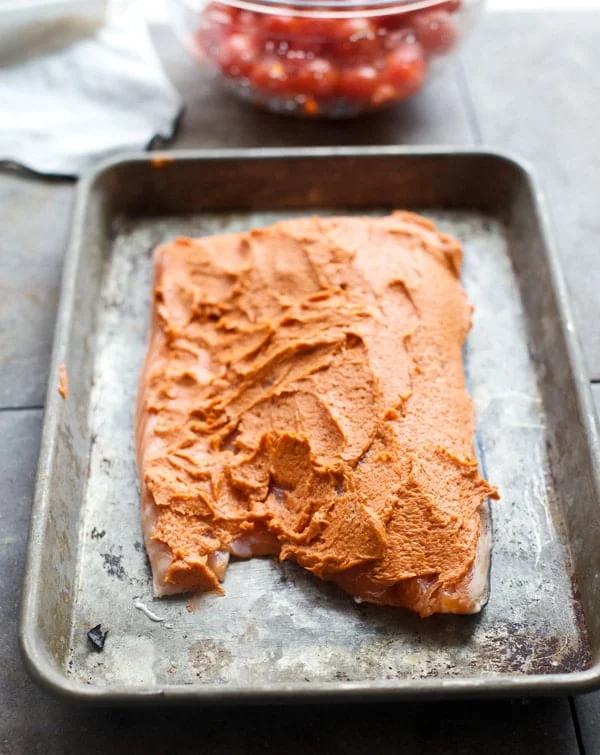 Salmon smothered in tomato butter