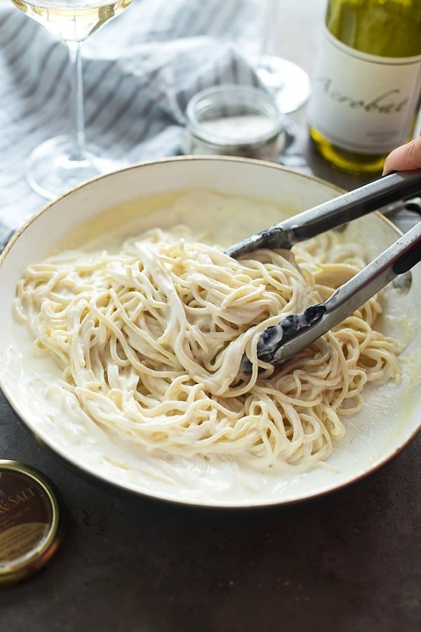 Toss spaghetti with truffle cream sauce