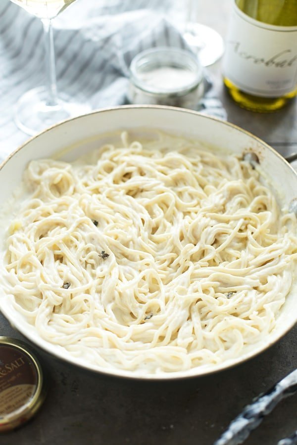 This Truffle Pasta with Triple Truffle Cream Sauce is the perfect way to make Valentine's Day (or any day!) a little extra special! Homemade spaghetti is twirled with heavy cream, and not one, not two, but three different forms of truffle – truffle butter, truffle gouda cheese and truffle salt.