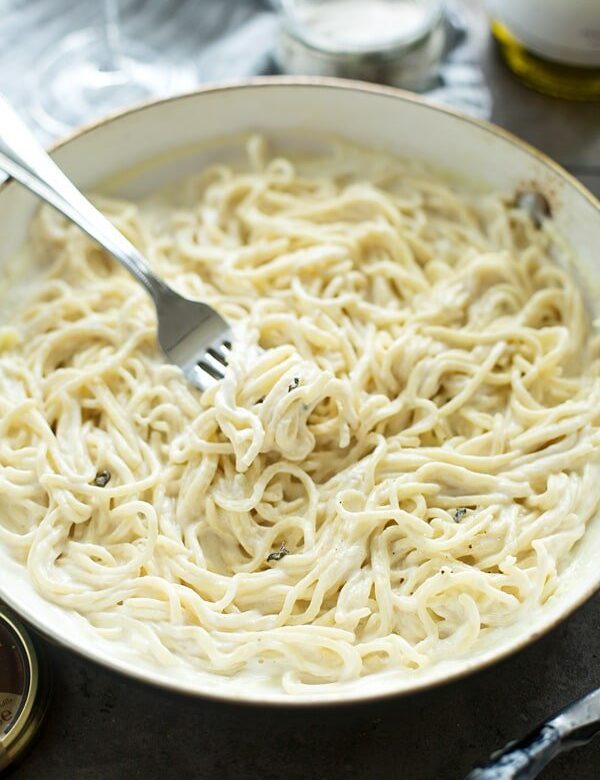 This Truffle Pasta with Triple Truffle Cream Sauce is the perfect way to make Valentine's Day (or any day!) a little extra special! Homemade spaghetti is twirled with heavy cream, and not one, not two, but three different forms of truffle – truffle butter, truffle gouda cheese and truffle salt.