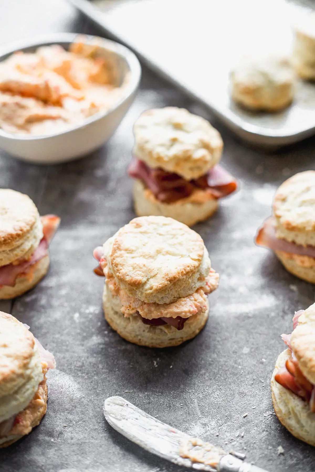 These Ham &amp; Pimento Cheese Sandwiches are simple, but bursting with flavor. We take our favorite biscuit recipe that's light, flaky, and oh-so delicious and smother the inside with warm pimento cheese and ham. The perfect bridal shower, lunch or side to soup or salad.