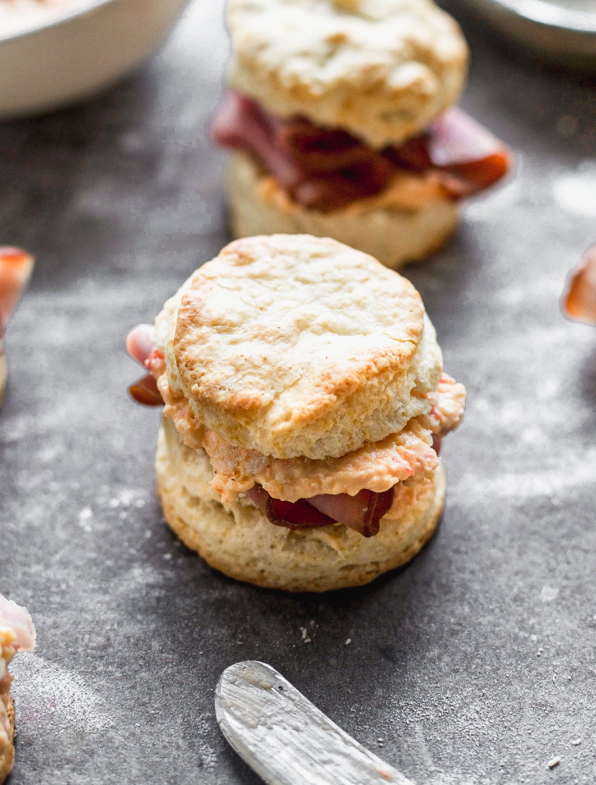 These Ham &amp; Pimento Cheese Sandwiches are simple, but bursting with flavor. We take our favorite biscuit recipe that's light, flaky, and oh-so delicious and smother the inside with warm pimento cheese and ham. The perfect bridal shower, lunch or side to soup or salad.
