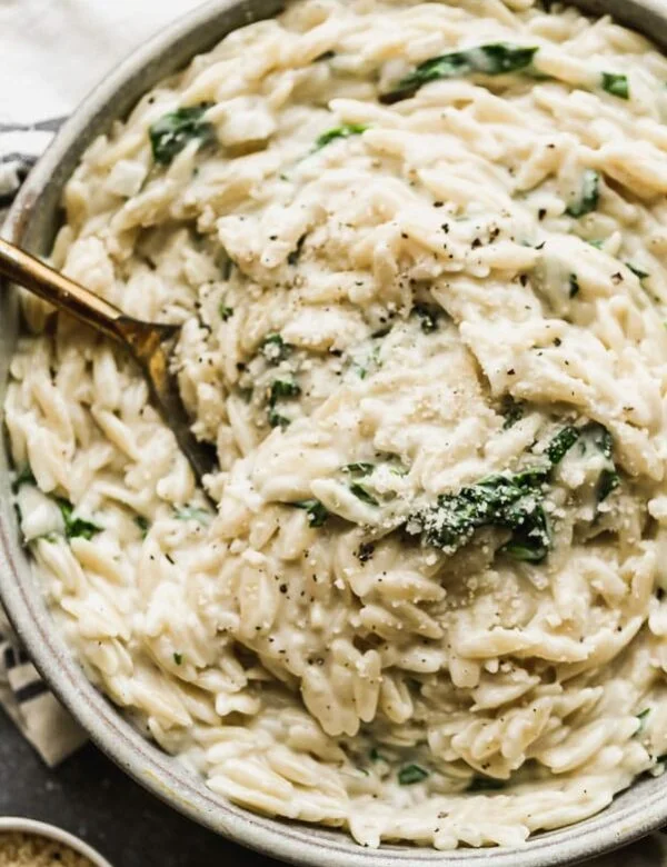This Creamy One Pot Spinach Orzo is better than any boxed pasta side you'll get at grocery store! Minimal ingredients and 25 minutes from start to finish.