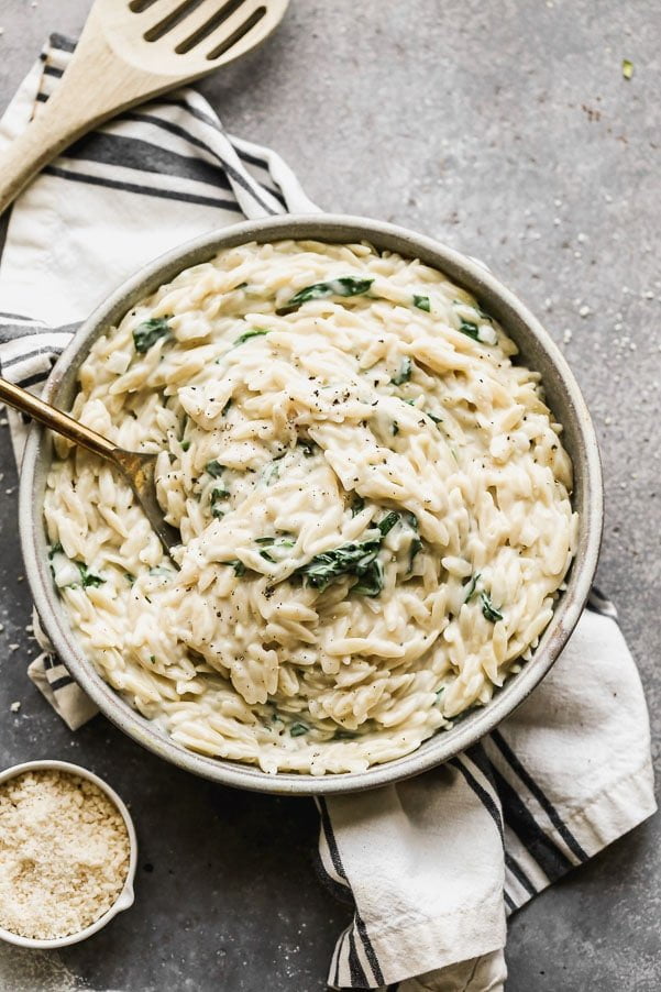This Creamy One Pot Spinach Orzo is better than any boxed pasta side you'll get at grocery store. It's easy, full of good-for-you ingredients and will pair perfectly with just about any entrée.
