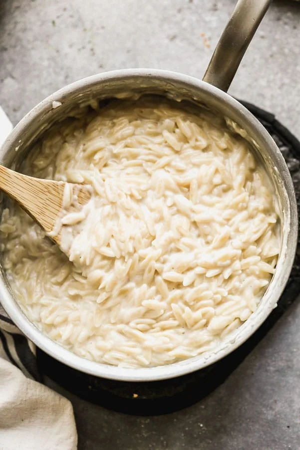 Orzo simmering in chicken stock and heavy cream. 