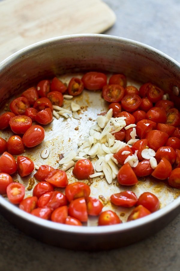 Garlic and cherry tomatoes cooked in olive oil 