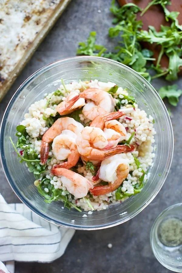 Roast shrimp on top of couscous salad