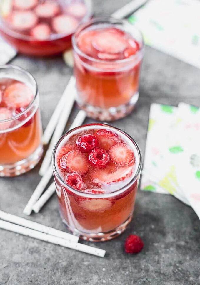 Rosé Sangria is the only cocktail you'll want to drink all summer long. Packed with fresh strawberries, dry rosé, and sparkling water, this is light and refreshing, effervescent, and perfect for a crowd!