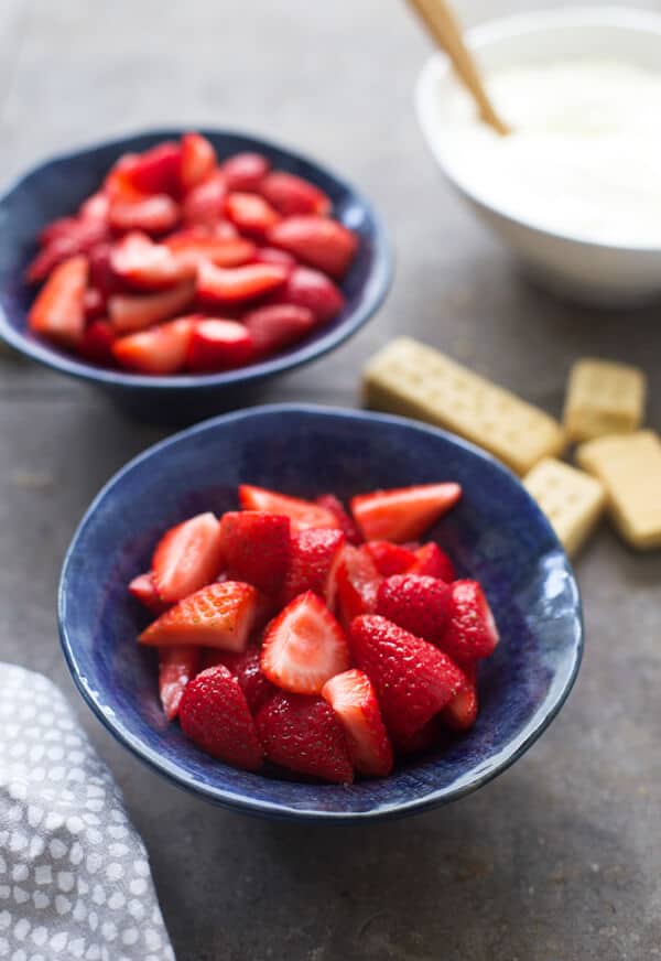 Sliced strawberries in individual bowls 
