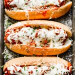 These Bolognese Turkey Meatball Subs are the perfect all-in-one meal. Melt-in-your-mouth turkey meatballs studded with carrots, celery, and some super secret ingredients are stuffed in crispy garlic butter rolls and covered in gooey mozzarella cheese. Heaven!
