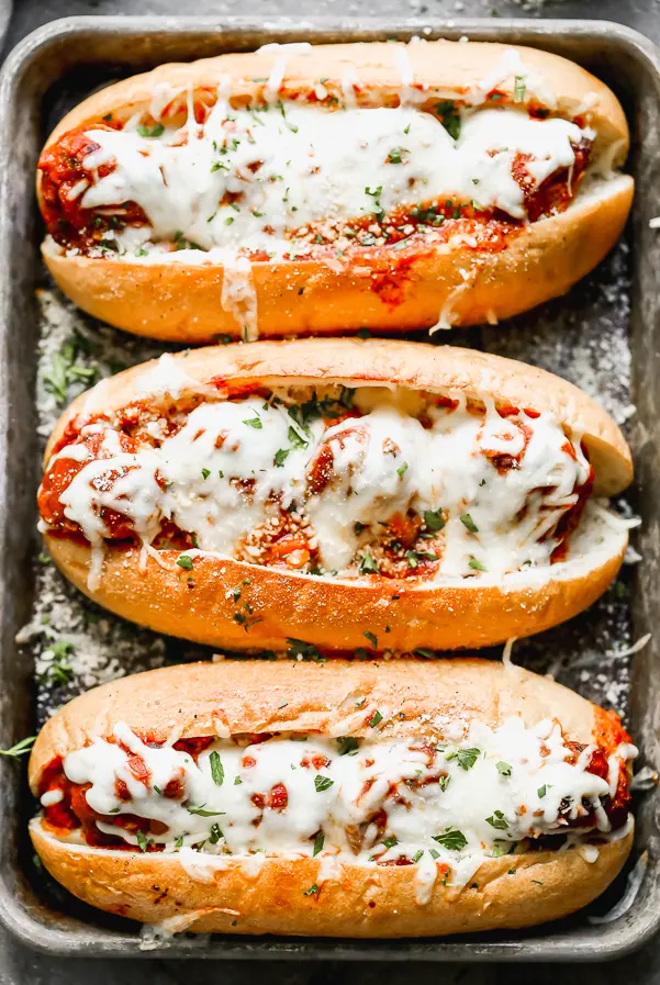 These Bolognese Turkey Meatball Subs are the perfect all-in-one meal. Melt-in-your-mouth turkey meatballs studded with carrots, celery, and some super secret ingredients are stuffed in crispy garlic butter rolls and covered in gooey mozzarella cheese. Heaven!