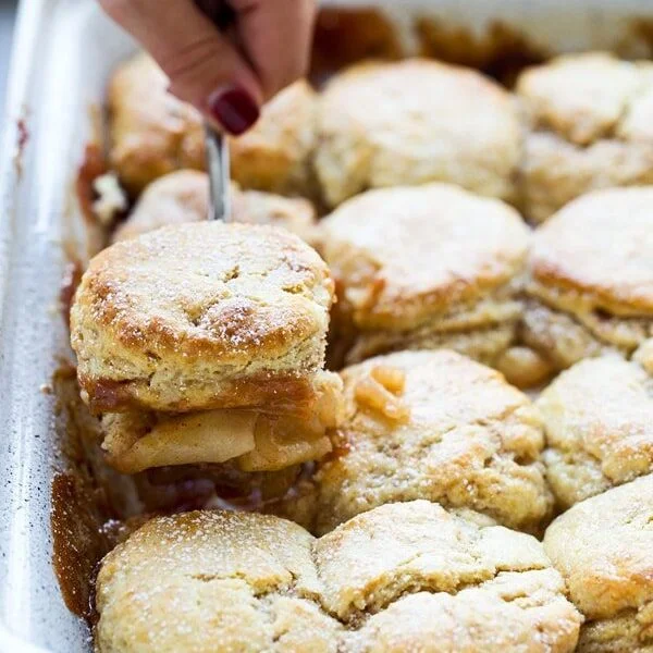 Easy Apple Cobbler with Sweet Cream - Flaky cinnamon biscuits top an easy apple filling for a sweet twist on a classic!