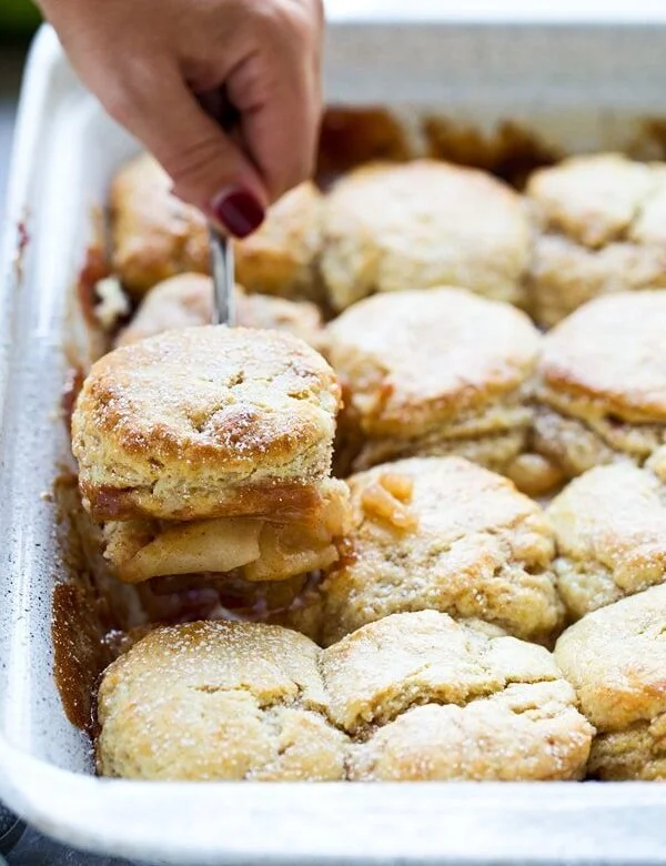 Easy Apple Cobbler with Sweet Cream - Flaky cinnamon biscuits top an easy apple filling for a sweet twist on a classic!