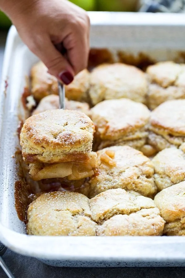 Easy Apple Cobbler with Sweet Cream - Flaky cinnamon biscuits top an easy apple filling for a sweet twist on a classic! 