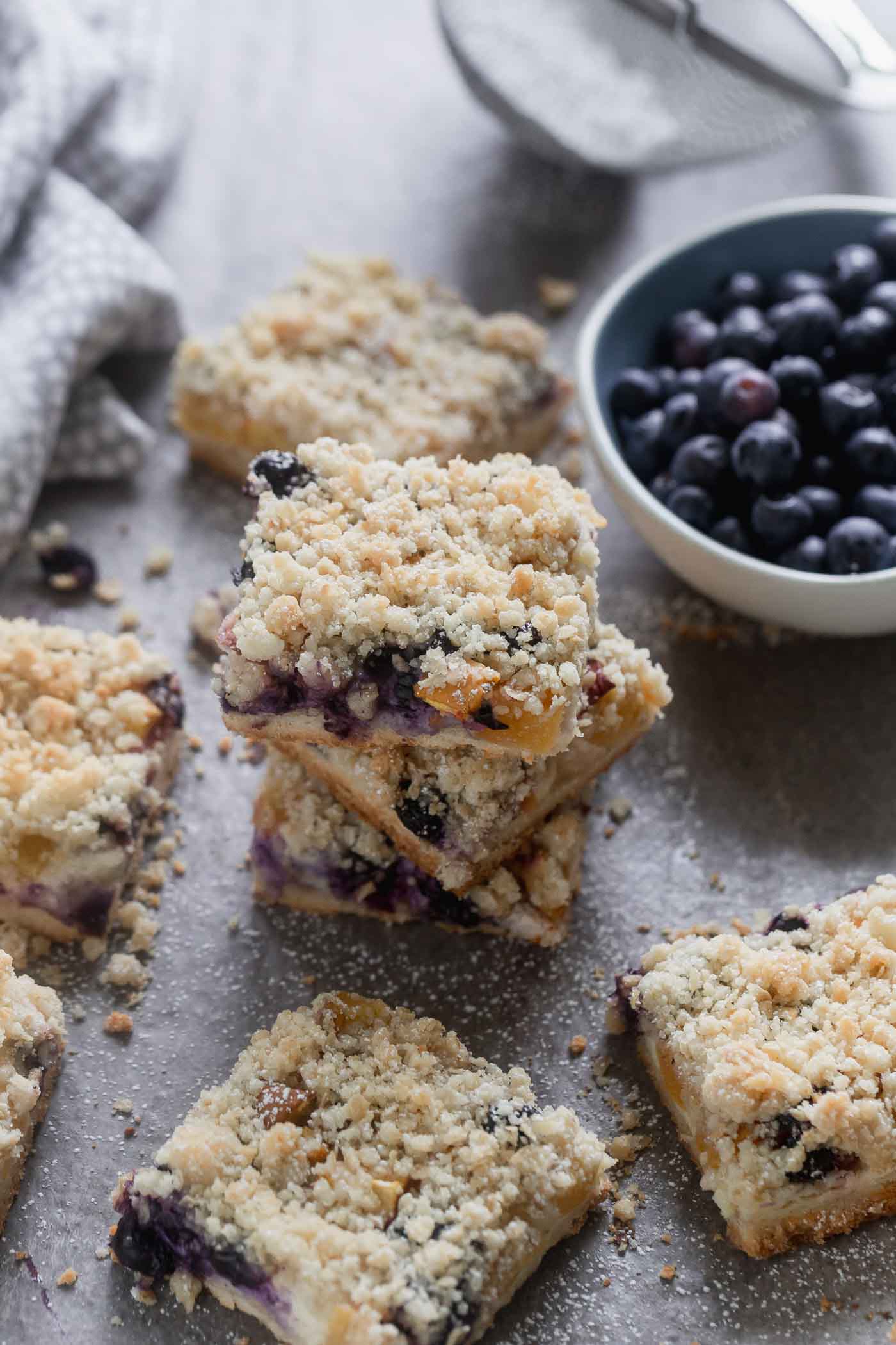 Blueberry Peach Cheesecake Crumble Bars