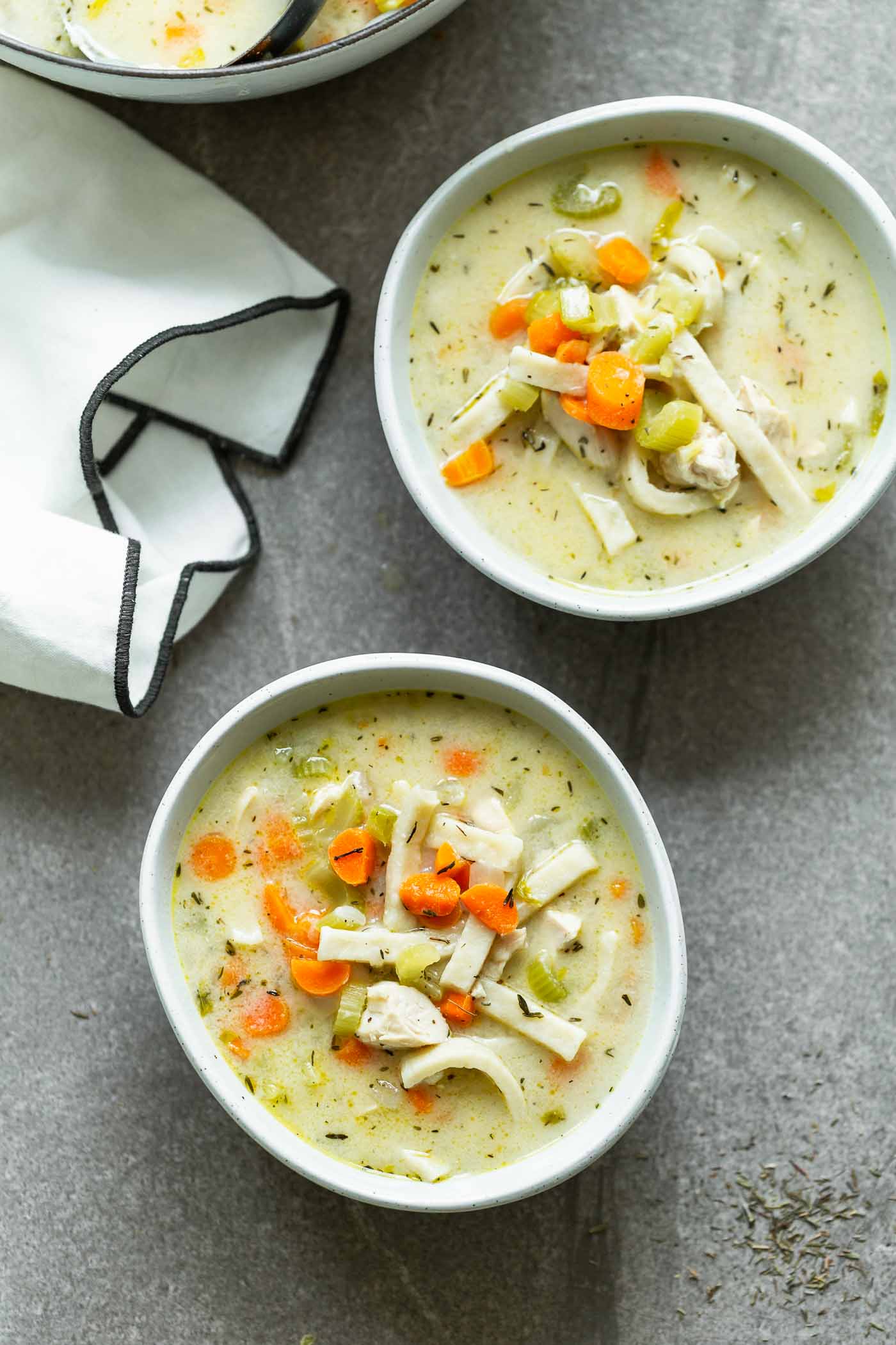 Creamy chicken noodle soup with egg noodles, carrots, celery, and chicken