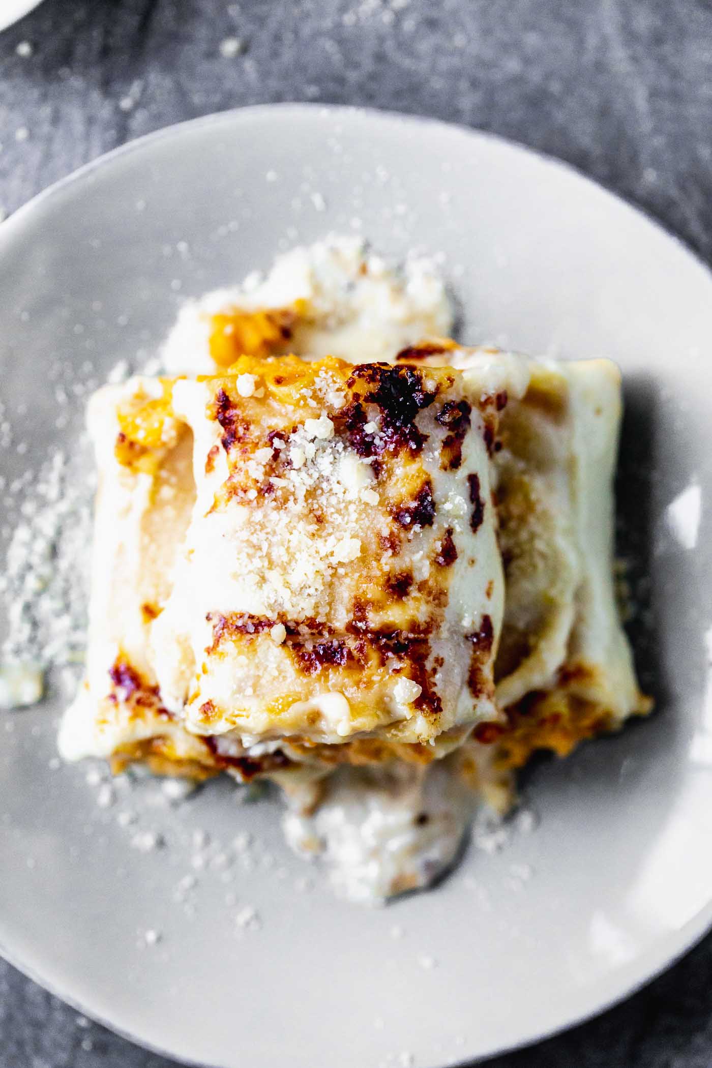 Butternut Squash Lasagna Rolls are cozy, rich and oh-so delicious. With only six ingredients, they're a cinch to throw together, and sure to impress a crowd.
