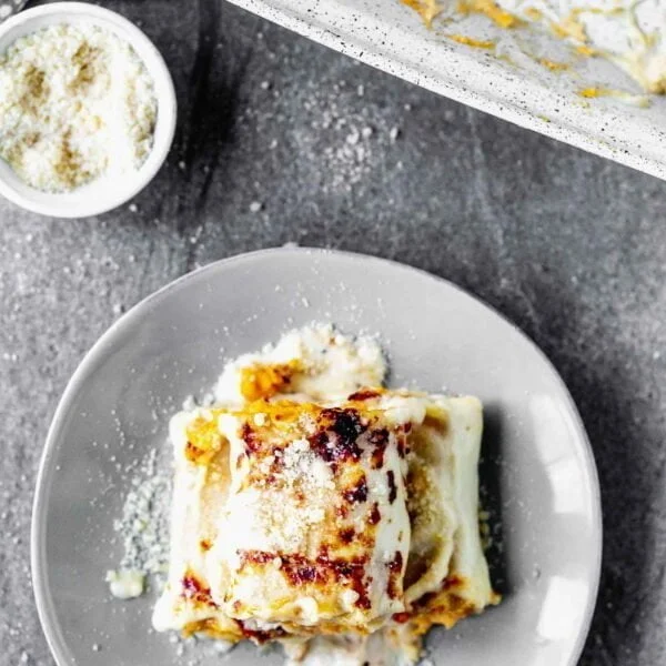 Butternut Squash Lasagna Rolls are cozy, rich and oh-so delicious. With only six ingredients, they're a cinch to throw together, and sure to impress a crowd.