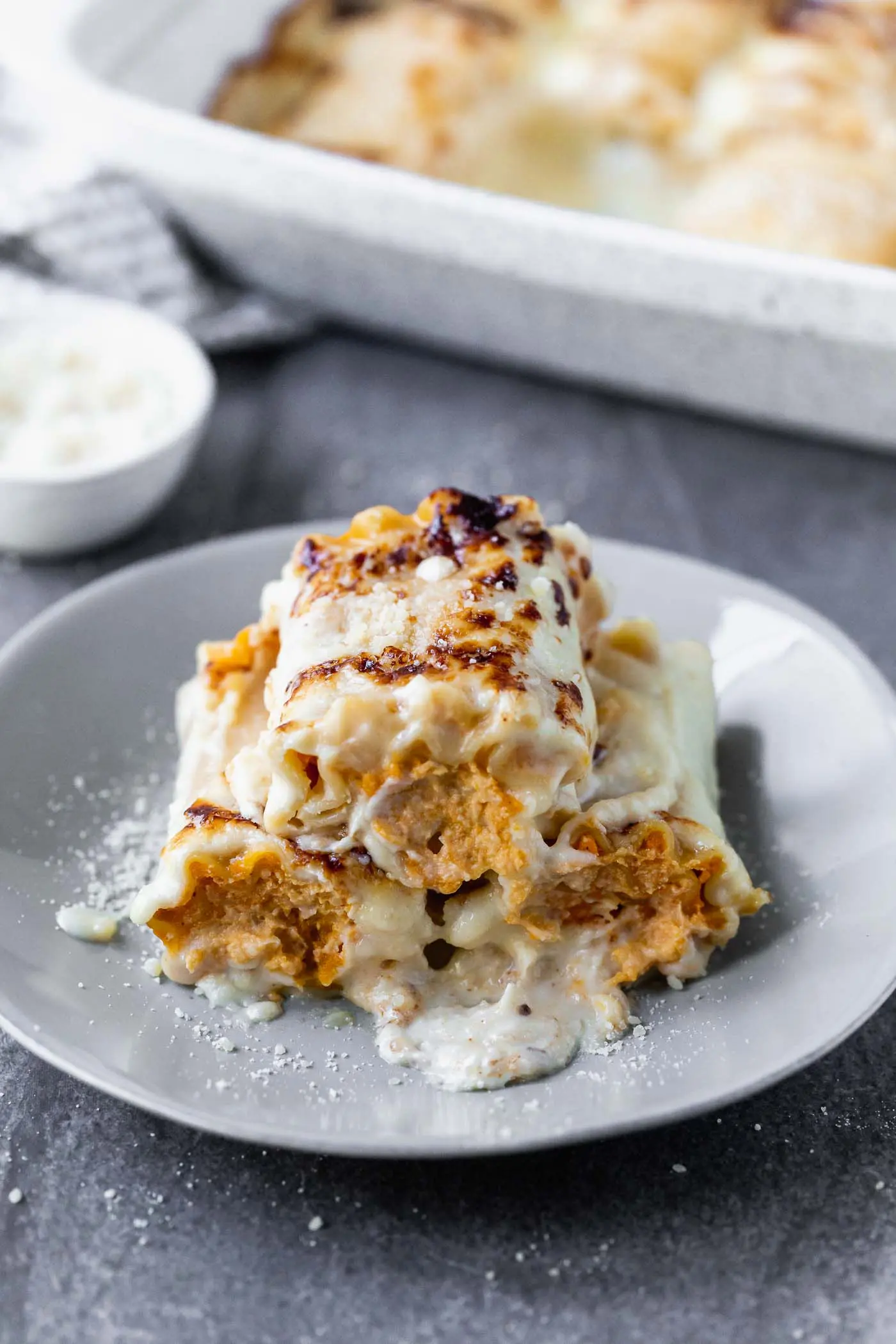 Butternut Squash Lasagna Rolls are cozy, rich and oh-so delicious. With only six ingredients, they're a cinch to throw together, and sure to impress a crowd.