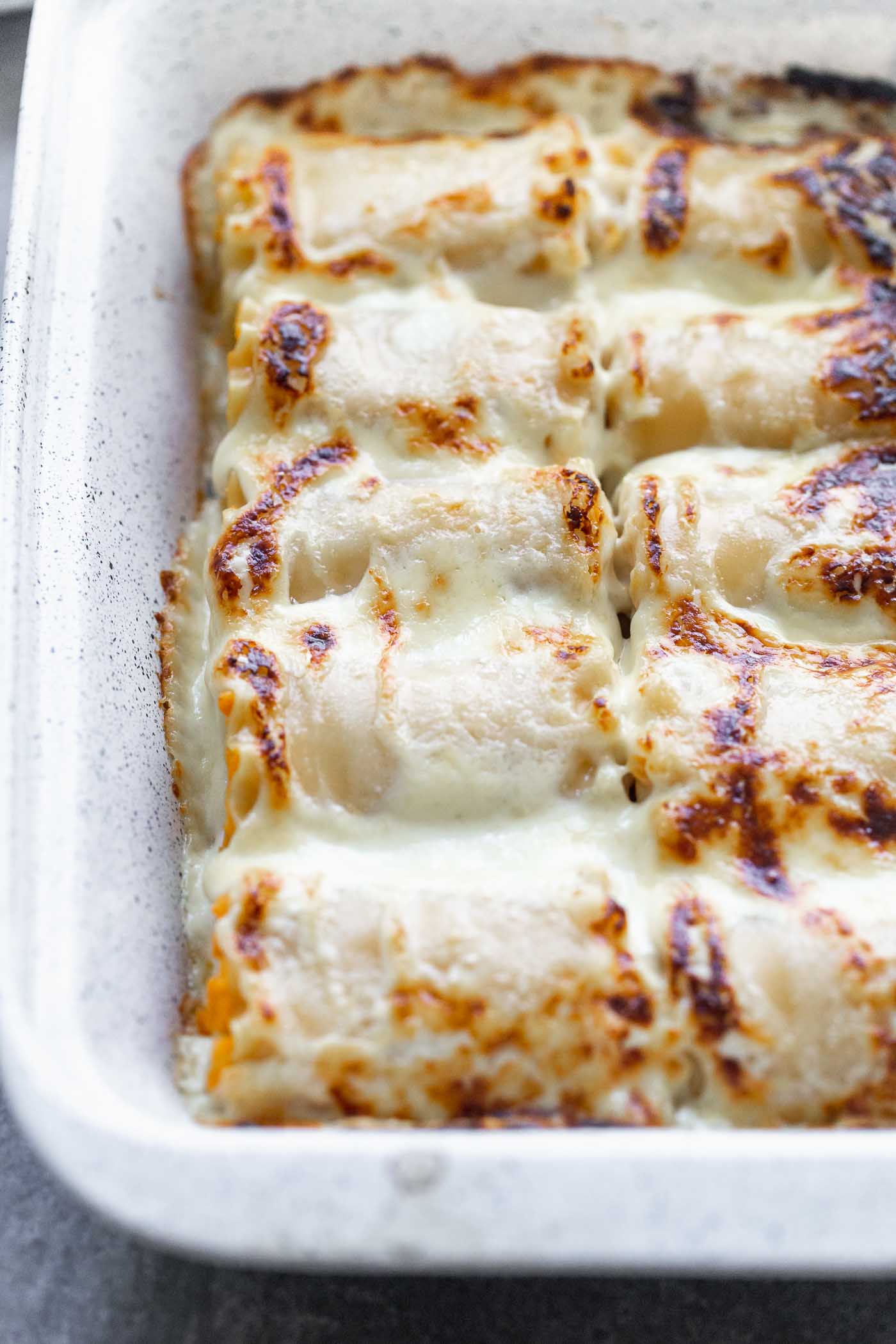 Butternut Squash Lasagna Rolls are cozy, rich and oh-so delicious. With only six ingredients, they're a cinch to throw together, and sure to impress a crowd.