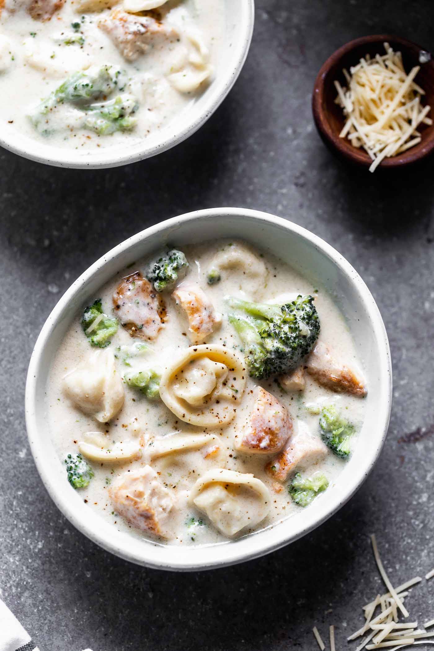 This Easy Chicken Broccoli Alfredo Soup is a one-pot meal perfect for a cold winter night. It’s packed with tender broccoli, a parmesan-laced cream sauce, seared chicken, and cheesy tortellini. Creamy and comforting!