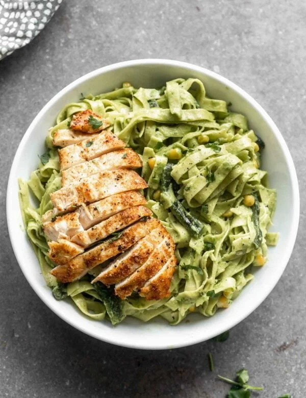 Creamy Roasted Poblano Pasta: Silky strands of tagliatelle pasta twirled in a smoky, spicy, DELICIOUS Poblano Cream Sauce. There's also hints of cilantro and garlic - yum! Perfect for date night, Friday night, or really, any night.