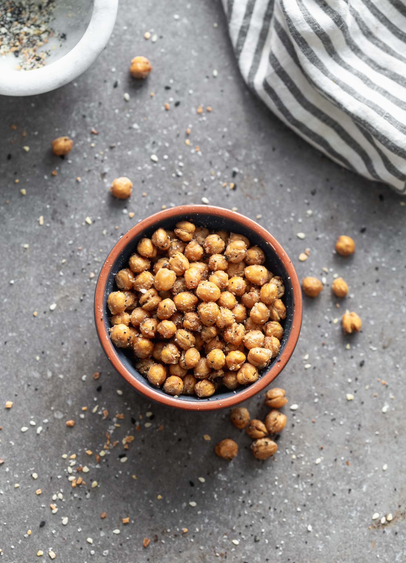 Crispy Everything Bagel Chickpeas are the perfect snack! They're covered in ground up everything bagel seasoning, tossed with olive oil and baked until golden brown and crispy. Store them in an airtight container and pull them out whenever you feel the need to snack!

