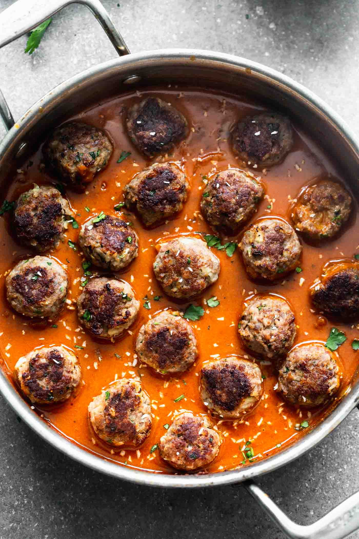 These Coconut Curry Meatballs require minimal ingredients, but have SO much flavor. They're packed with garlic, ginger, onion and cilantro, browned until crisp, and bathed in a luscious coconut curry sauce. Only 30 minutes from start to finish!&nbsp;
